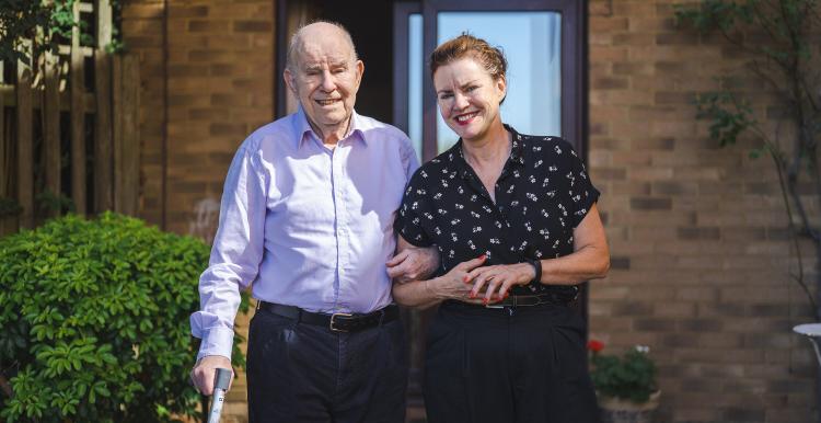 Female carer looking after her elderly father 