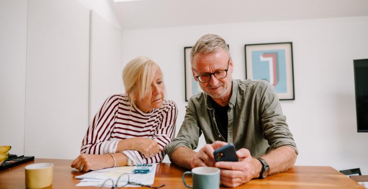 Older couple working out their pension credit