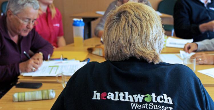 Image of Healthwatch West Sussex staff and volunteers in a meeting