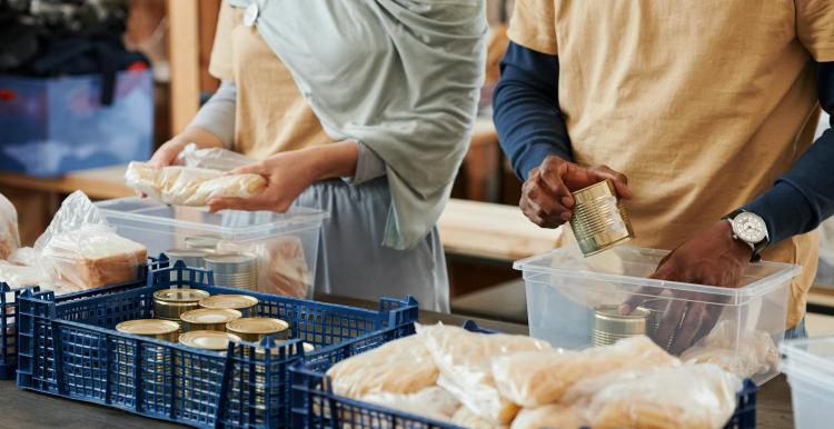 Food bank organising tins and rice