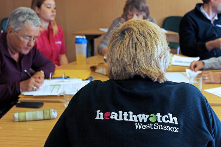Image of Healthwatch West Sussex staff and volunteers in a meeting