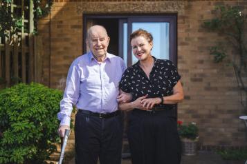 Female carer looking after her elderly father 