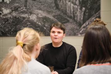 Visually impaired person chatting with others