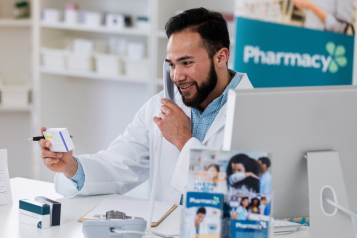 Pharmacist on phone with prescriptions