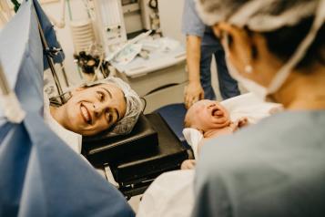 Baby being born via c-section in a hospital