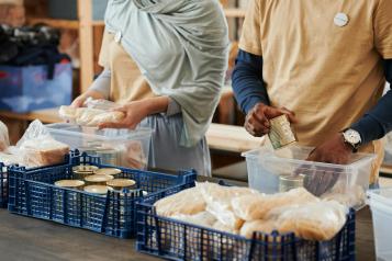 Food bank organising tins and rice