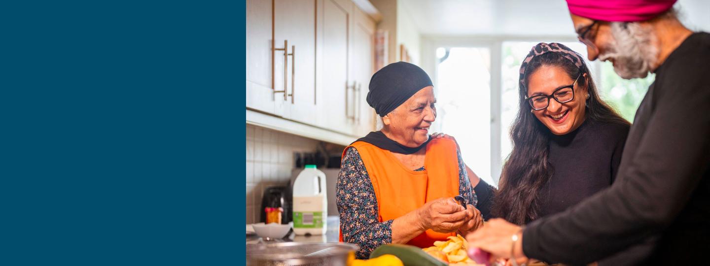 Lady helping her elderly parents prepare dinner