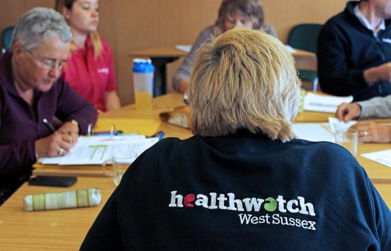 Image of Healthwatch West Sussex staff and volunteers in a meeting